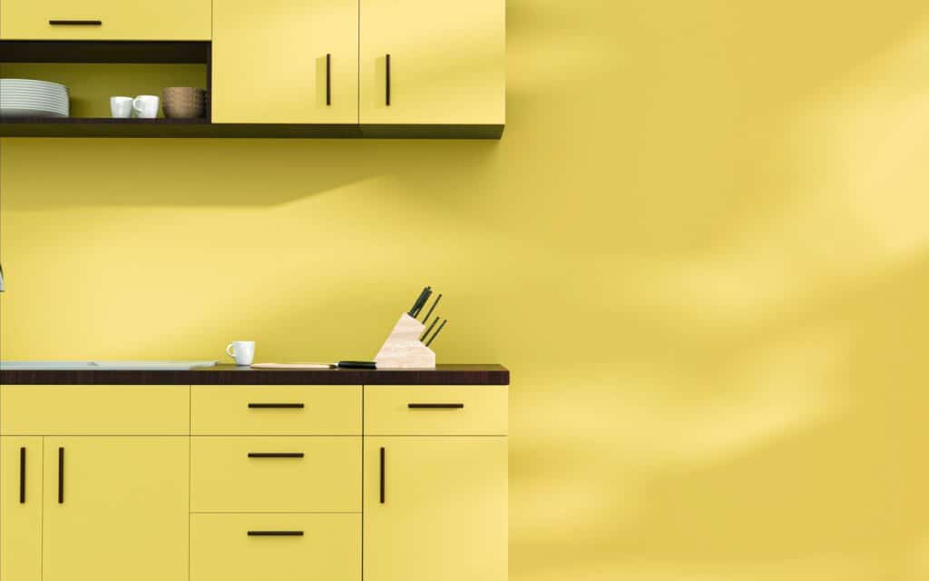 Beautiful chartreuse cabinets being highlighted in a modern kitchen, demonstrating trendy kitchen cabinet colors.