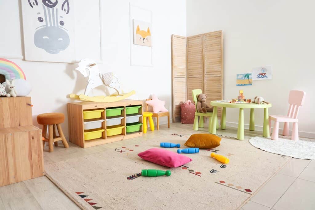 Brightly decorated kid's room with vibrant furniture, soft toys, and playful decor, featuring walls painted with smooth interior paint finishes that enhance the space.