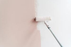 One of the affordable painters in Wichita, KS, painting a wall.