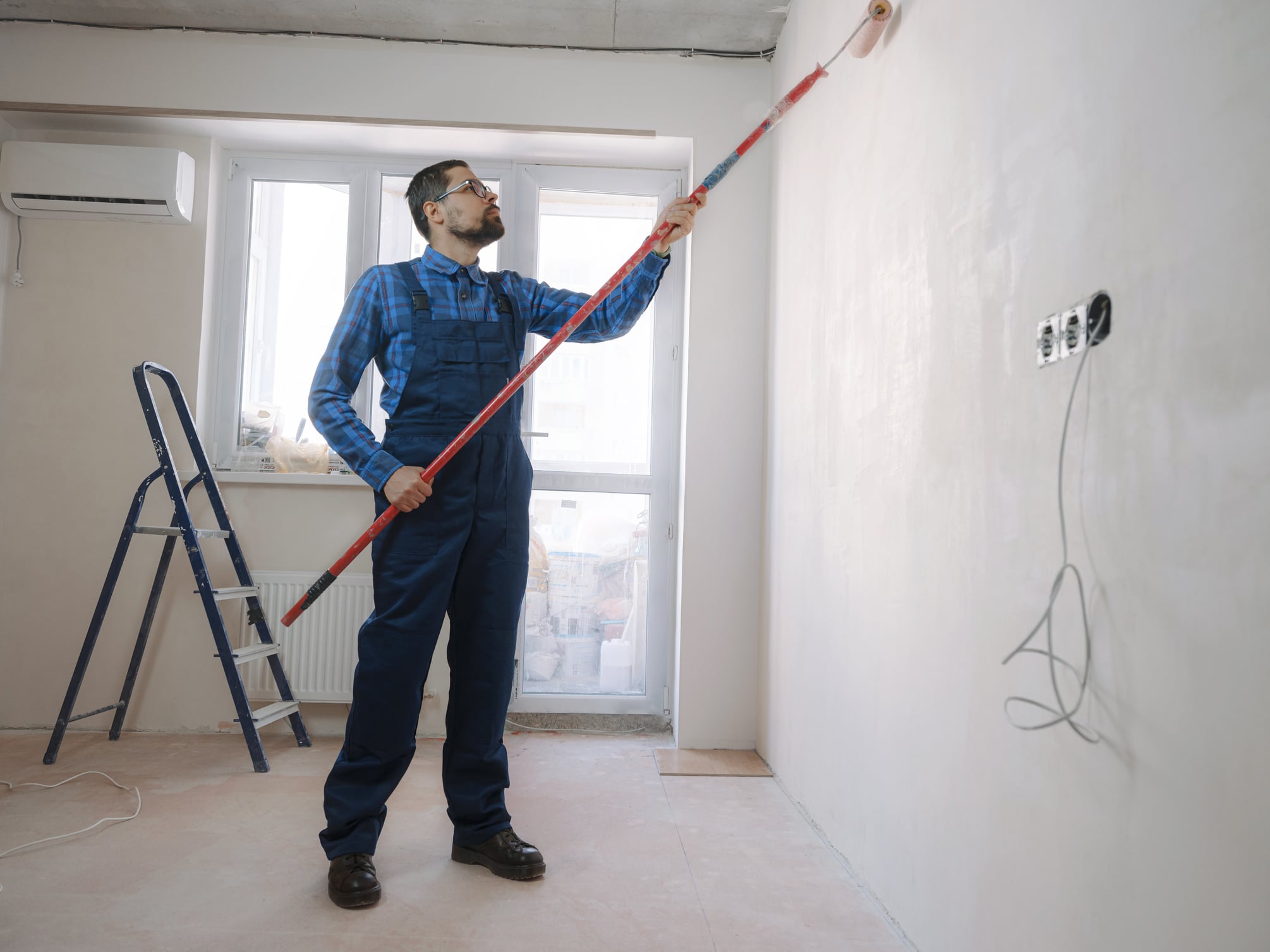A house painting Wichita KS contractor beginning an interior painting project. 