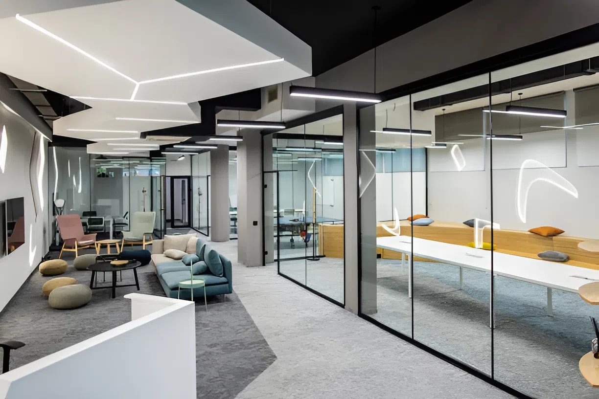 Office interior with smooth neutral gray and white walls, clean matte finishes by a commercial painter in Wichita, KS.