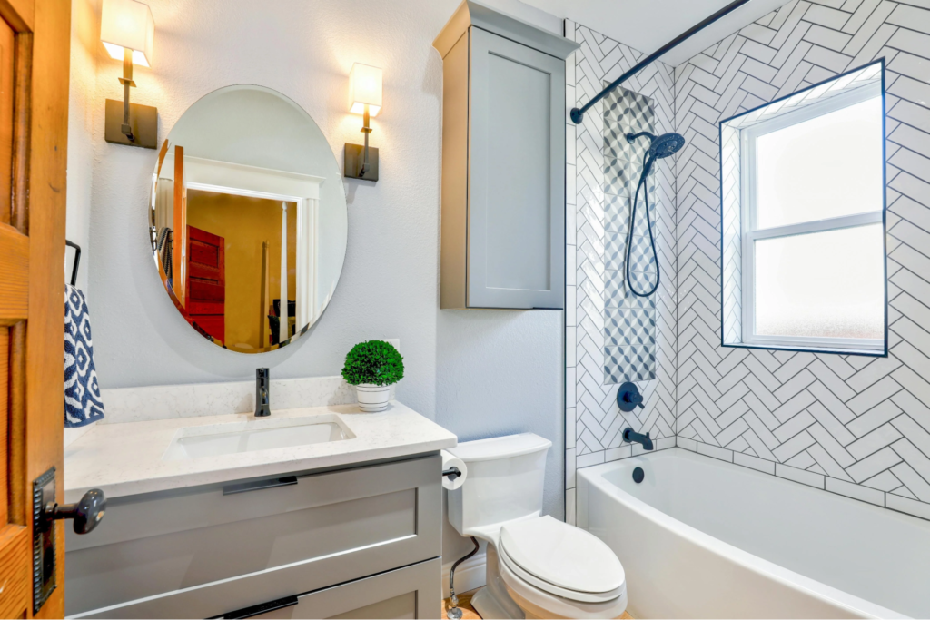 Light gray bathroom wall paint with clean finishes by an interior painter in Andover, KS.