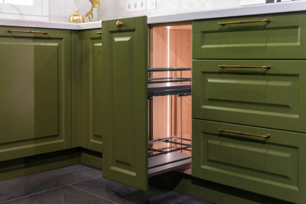 Olive green shaker-style cabinets with a satin finish by an interior painter in Derby, KS.