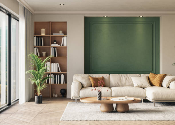 Living room with soft beige walls and a deep green accent wall by a house painter in Goddard, KS