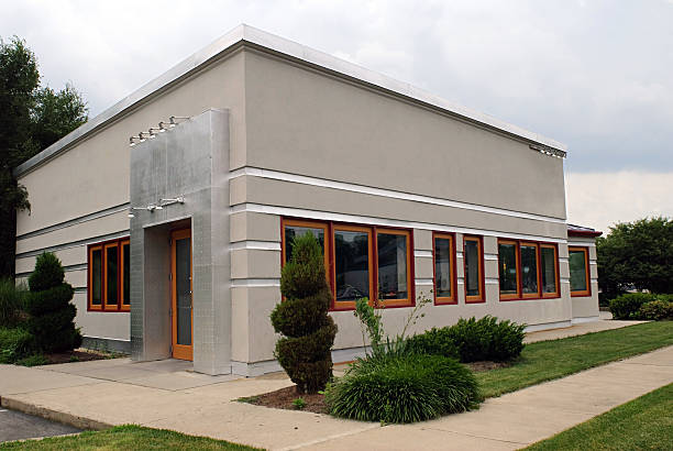 Commercial building with light gray exterior paint and durable exterior finishes by an exterior painter in Valley Center, KS.
