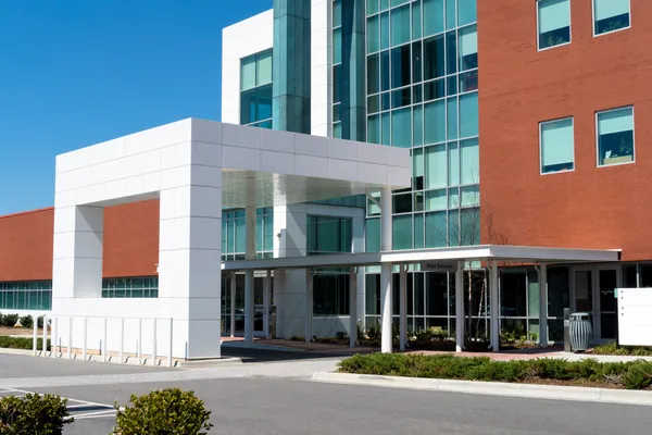 Commercial building with blue-gray exterior and textured finishes by a painter in Derby, KS.